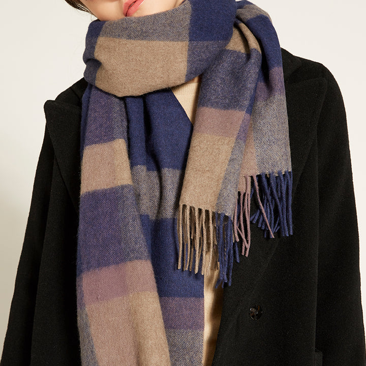 Elevate your winter style with the Serene Plaid Shawl. Crafted from 100% yak wool, this soft and warm accessory in Earth, Dusk, and Iris adds elegance to any look.

