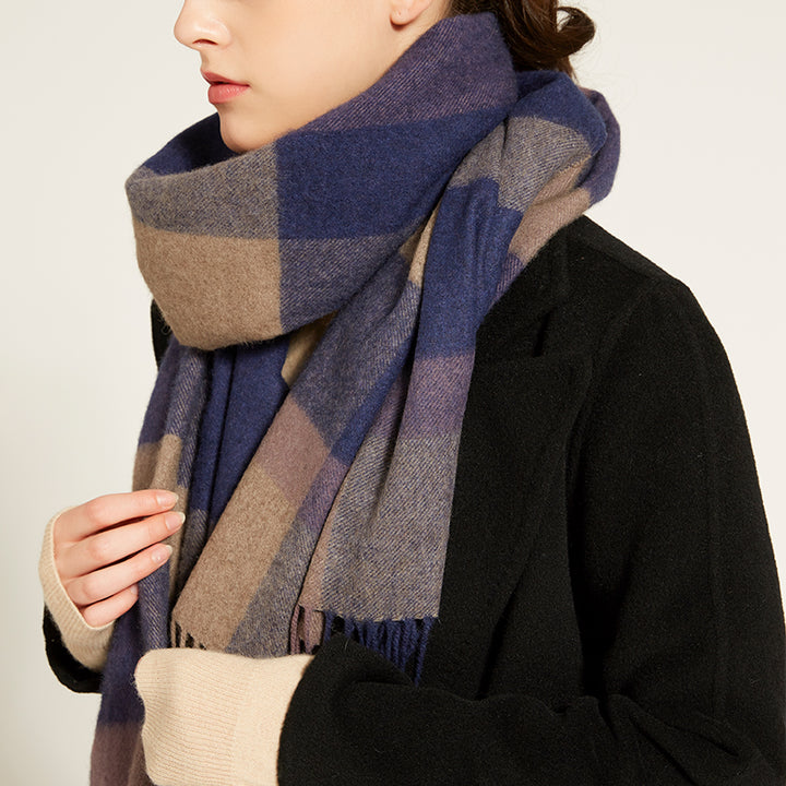 Elevate your winter style with the Serene Plaid Shawl. Crafted from 100% yak wool, this soft and warm accessory in Earth, Dusk, and Iris adds elegance to any look.

